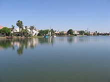 A waterfront in the Val Vista Lakes community in Gilbert Picture of lake front in Val Vista Lakes in Gilbert, Arizona, USA.jpg
