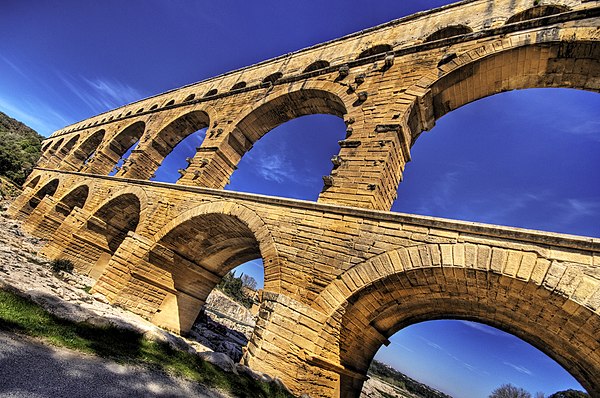 Pont du Gard's stone blocks, some of which weigh up to six tons, were precisely cut to fit together without the need for mortar.