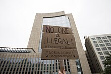 A gathering of approximately 200 people took place at the Diana E. Murphy United States Courthouse in downtown Minneapolis to express their dissent towards the US Supreme Court's ruling in support of the travel ban on individuals from Muslim countries, which was authorized by Republican President Donald Trump Protest against the Trump Muslim travel ban, Minneapolis, MN.jpg