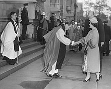 Bishop Horace W. B. Donegan greets Queen Elizabeth The Queen Mother on the steps of the cathedral on the day of the Columbia University Bicentennial, October 31, 1954. QueenMotherDonegan.jpg
