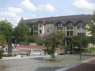 Lohfelden is a municipality in the district of Kassel, in Hesse, Germany. It is situated 6 km southeast of Kassel. It has three parts Crumbach, Ochsenhausen and the former independent Vollmarshausen.