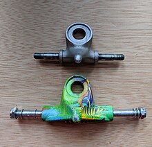 Photo of two different roller skate trucks