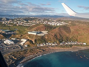 Aerial view of Moa Point, showing the airport to the left and the sewage treatment plant on the hill above the houses.