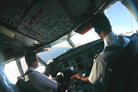 Quote from the image description: "The first officer of an Air France A320 Family aircraft completes the approach to runway 22R of the Nice Côte d’Azur airport. A result of infrequent south-westerly winds, the approach to Nice airport’s parallel runways 22 requires a visual approach with a salient late left turn over Nice’s Baie des Anges."