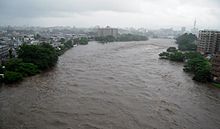 Picture show at heavy rain, following flood in Shira River, Kumamoto, Kyushu, July 2012 Sirakawa zosui.jpg