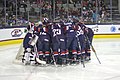 Team USA huddles at their goal before starting a exhibition match against Team Canada.