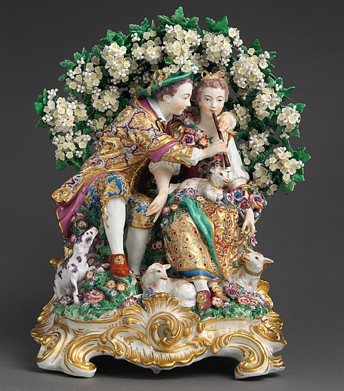 The Music Lesson, gold anchor, Chelsea porcelain, c. 1765, with bocage background. 15 3/8 × 12 1/4 × 8 3/4 inches, 22 lb. (39.1 × 31.1 × 22.2 cm, 10 k