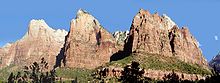 Massive cliffs in Zion Canyon consist of Lower Jurassic formations, including (from bottom to top): the Kayenta Formation and the massive Navajo Sandstone The Three Patriarchs in Zion Canyon.jpg
