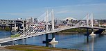 Tilikum Crossing with streetcar and MAX train in 2016.jpg