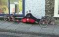 Trike propelled by two cyclists back-to-back