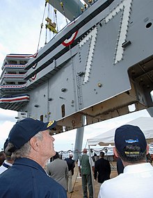 Placement of the 700-ton island onto the ship's flight deck in 2006 USS George H. W. Bush (CVN-77) island landing.jpg