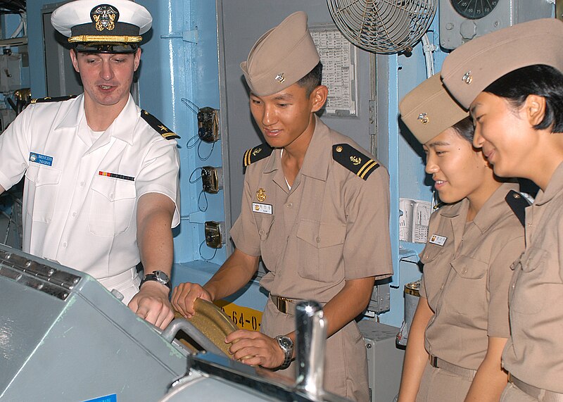 File:US Navy 030816-N-3931M-006 Lt. Brent Zito, left, explains the ship's navigation system to midshipmen from the Republic of Korea (ROK) in the pilot house aboard USS Blue Ridge (LCC 19).jpg