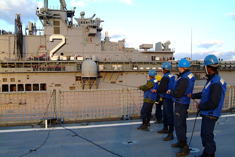 File:US Navy 060205-N-4772B-126 The amphibious dock landing ship USS Harpers Ferry (LSD 49) Sailors tend a station to station phone line with the amphibious assault ship USS Essex (LHD 2), during a scheduled underway replenishment (.jpg