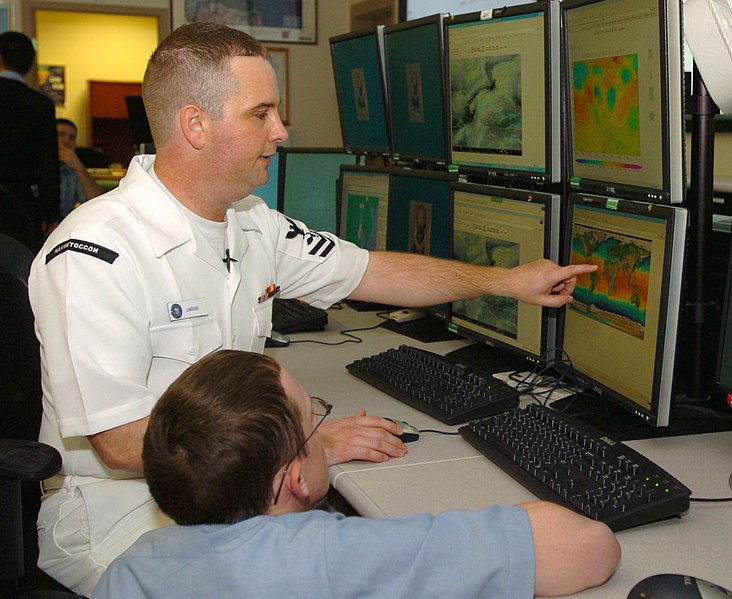 File:US Navy 060413-N-1924T-123 Aerographer's Mate 2nd Class Joseph Lawrence gives training to Aerographer's Mate Airman Brett Dubovecky on hurricanes.jpg