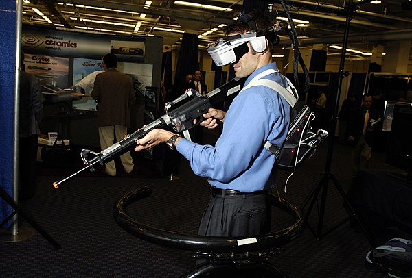 Engineer research psychologist from the Naval Research Laboratory (NRL) demonstrates the Infantry Immersive Trainer (IIT), one of several Virtual Trai