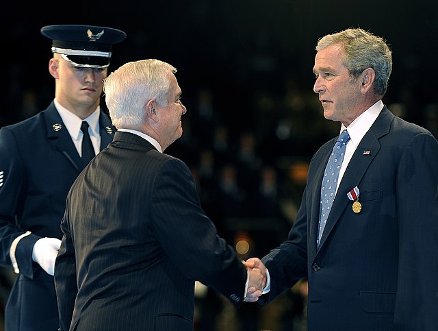 Secretary of Defense Robert M. Gates awards the medal to President George W. Bush.