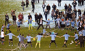 Uruguay players celebrating CA triumph.jpg