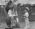 Visiting Indian Chief High Eagle talks with Johnny Schneider (aged about 3 or 4 and dressed in cowboy outfit), White City, Sydney, 11 Jan 1935 - photographer Sam Hood (10831814474).jpg