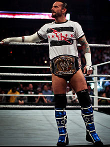 CM Punk wearing the "Spinner Belt" (2005-2013) version of the WWE Championship WWE Champion CM Punk.jpg