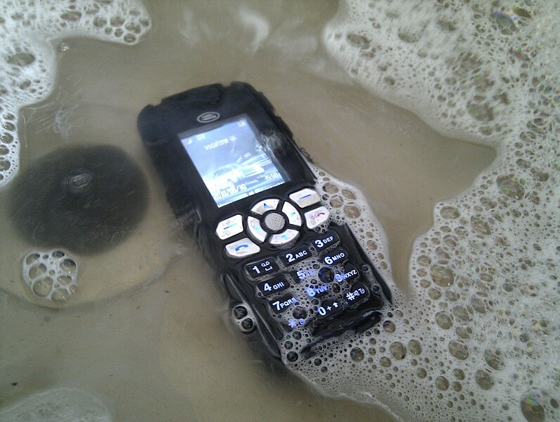 File:Washing my phone after gardening.jpg