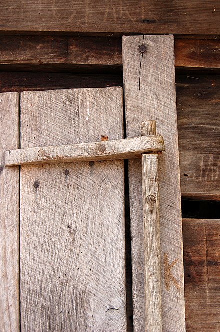 A through mortise is used in this wooden hinge.
