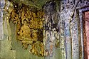 The most intact painting in Cave 6: Buddha seated in dharma-chakra-mudra[147]