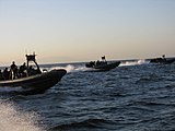 Philippine Navy rigid hull inflatable boats perform a maritime interdiction operation exercise in Manila Bay.