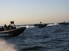 Philippine Navy rigid hull inflatable boats perform a maritime interdiction operation exercise in Manila Bay. 100204-N-3879W-023.jpg