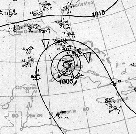 Map showing shorelines and the coordinate grid in light gray. Black contours on the map denote isobars; the presence of concentric isobars at the center of the image denote the location of a tropical cyclone.