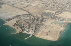 Aerial view of parts of Al Qassar منطقه ۶۱ (قطر) (left) and Al Qassar منطقه ۶۶ (قطر)، separated by Katara Street, in 2010