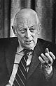 Alistair Cooke, head-and-shoulders portrait, facing front, gesturing with left hand, during interview, March 18, 1974.jpg