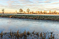   Bevroren landschap bij zonsopgang. It Súd De Fryske Marren.