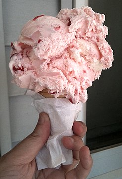 A cherry ice cream cone