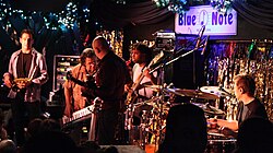 At the Blue Note in New York City. Left to right: Eric Marienthal (saxophone), Chick Corea (keyboard), Frank Gambale (guitar), Victor Wooten (bass), Dave Weckl (drums)