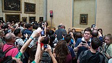 Overtourism at the Louvre Crowd looking at the Mona Lisa at the Louvre.jpg