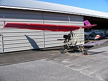 DFE Ascender III-C in front of its hangar. The aircraft in the background is a Quad City Challenger II.