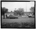 East front of building, with vehicle inspection in foreground. View to northwest. - U.S. Customs Service Port of Roosville, Main Port Building, U.S. Highway 93, immediately south of U HABS MT-110-A-2.tif