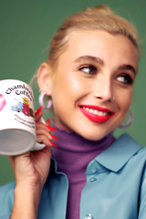 Chamberlain posing with a Chamberlain Coffee mug Emma Chamberlain for Chamberlain Coffee, 2020 (2).png