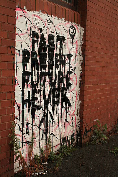 File:Graffiti in Shoreditch, London - Past present future never (13785279875).jpg