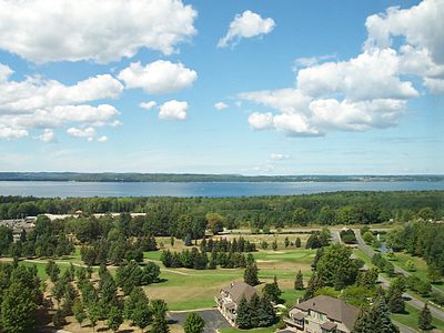 The East Arm of Grand Traverse Bay from the east, with the Old Mission Peninsula in the background.  Hills of the Leelanau Peninsula are faintly visible on the horizon.