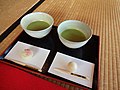 Japanese tea tray with two cups of matcha along with some sweets during a tea ceremony.jpg