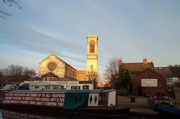 Boaters protest against the proposed sale of the Castle Mill Boatyard on the Oxford Canal, 2005, with St Barnabas Church in the background.
