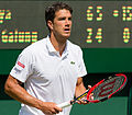 Jesse Huta Galung competing in the first round of the 2015 Wimbledon Qualifying Tournament at the Bank of England Sports Grounds in Roehampton, England. The winners of three rounds of competition qualify for the main draw of Wimbledon the following week.