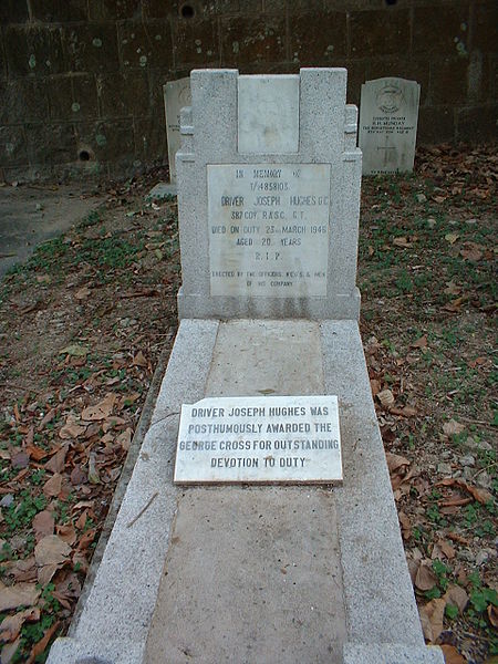 Grave of Driver Joseph Hughes GC, who won the George Cross due to his warning of bombs to his fellows in Hong Kong Cemetery.