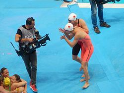 Liu Xiang (in pink) and teammate Fu Yuanhui celebrating at the 2015 World Aquatics Championships in Kazan.