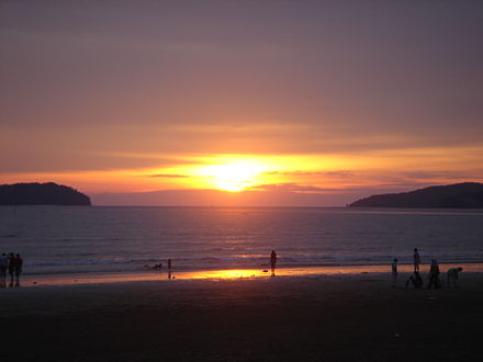 Sunset at Tanjung Aru beach. Sulug Island can be seen on the left and Manukan Island on the right of the horizon.