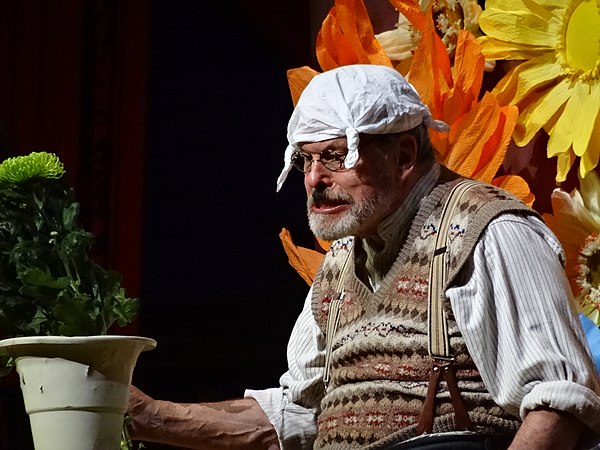 A character of limited intelligence and vocabulary, Gumby (played by Gilliam) flower arranging at the 2014 reunion. The Gumbys were part of the Python