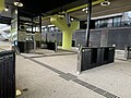 The Myki readers, lift, main concourse and the curved metal fence around the Myki readers, July 2024