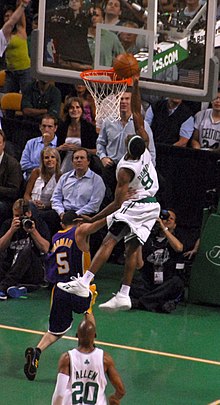 Jordan Farmar (No. 5 in purple) flagrantly fouls Rajon Rondo (No. 9 in white) as Rondo attempts a dunk. NBA flagrant foul.jpg