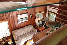 File:Nathan_Cobb_Cottage_-_Interior_2nd_Floor_Loft_Looking_Down_to_Living_Room_-_photograph_ca._2021.jpg